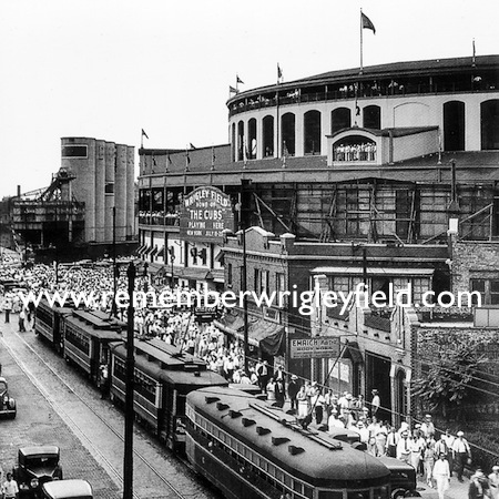 Chicago Cubs fans line Clark Street outside Wrigley Field in 1935 as the trolley delivers more people to the park